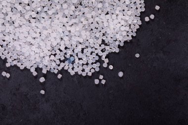 Small Plastic pellets. Micro plastic. air pollution. clipart