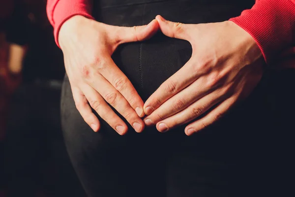 Booty girl in a black sportswear on a dark background close-up. — Stock Photo, Image