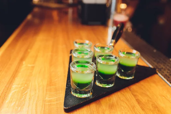 Barman make alcoholic shots with rum and liquor. — Stock Photo, Image