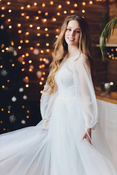 The beautiful woman posing in a wedding dress. — Stok fotoğraf