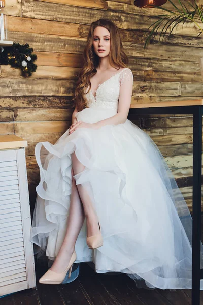 The beautiful woman posing in a wedding dress. — 스톡 사진