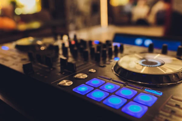 DJ remote, turntables, and hands . Night life at the club, party. — Stock Photo, Image