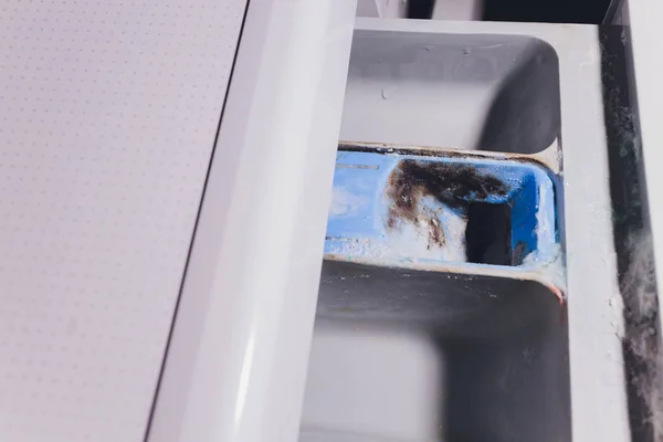 Tray for washing powder in the washing machine dirty damp. — 图库照片