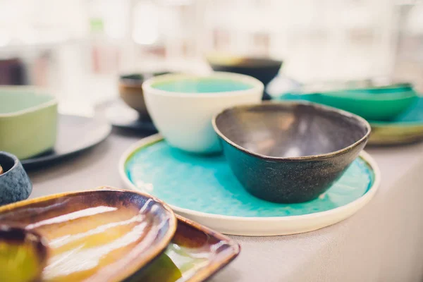 Designer handmade dishes, plates and cups in a stylish boutique.