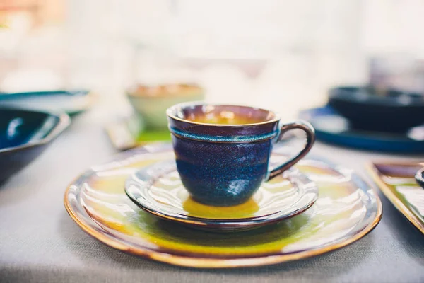 Designer handmade dishes, plates and cups in a stylish boutique.
