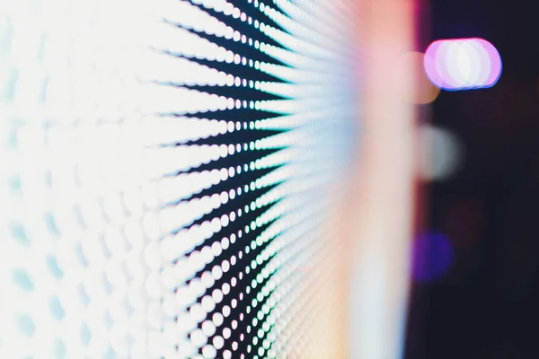 Bright colored blue LED wall with pink pattern - close up background.