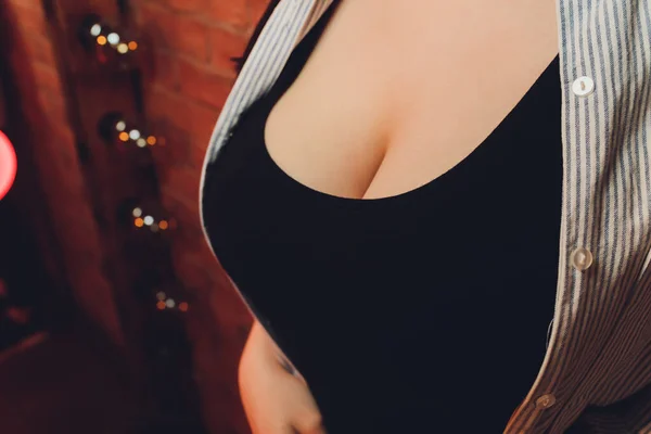Neckline, beautiful large female breast, dress, close-up. — Stock Photo, Image