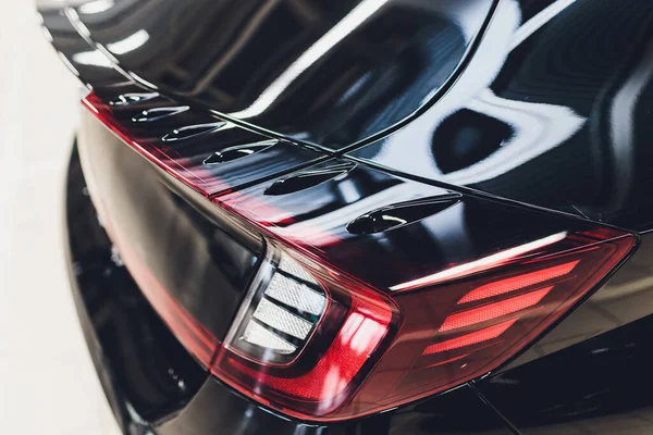 Car detail. New led taillight by night. The rear lights of the car, in hybrid sports car. Developed Cars rear brake light.