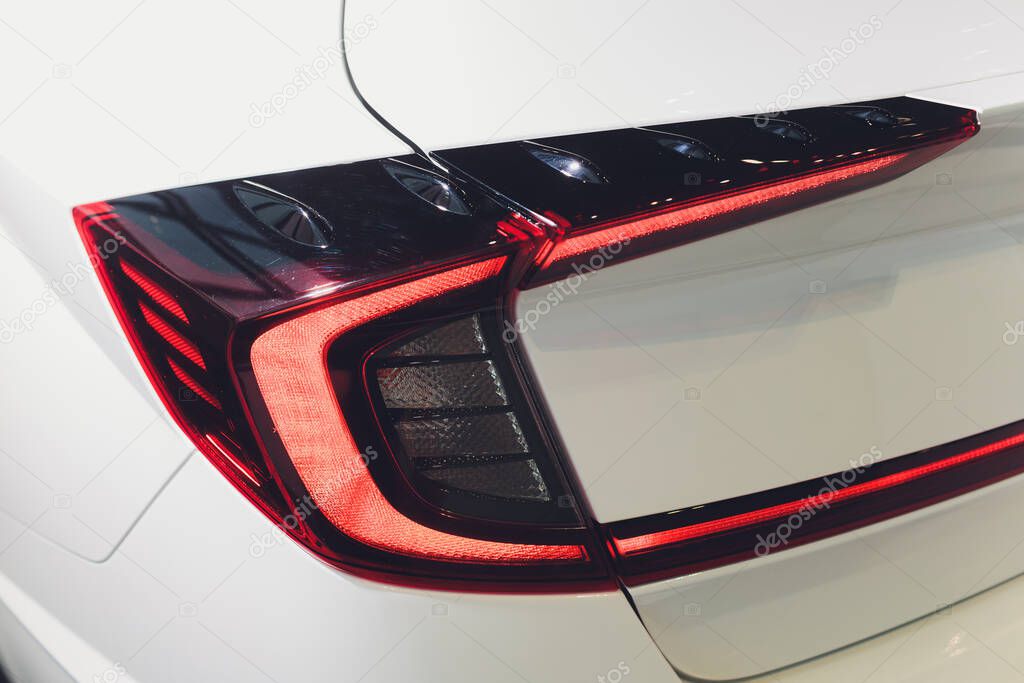 Car detail. New led taillight by night. The rear lights of the car, in hybrid sports car. Developed Cars rear brake light.