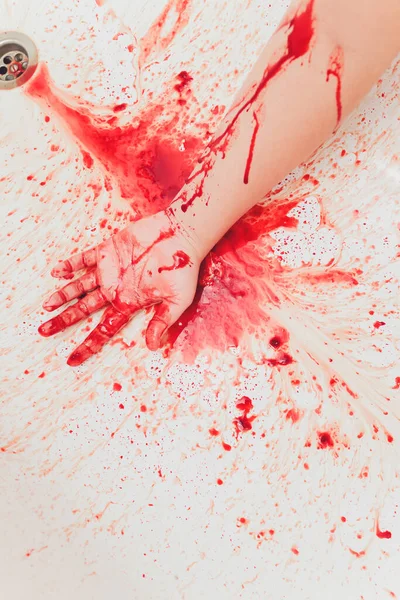 Bloody hand of depressed woman in shower. — Stock Photo, Image