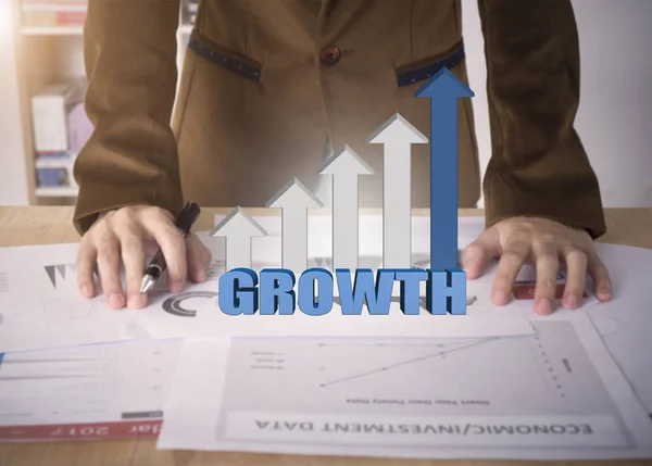 Business worker with graph growth on desk office. — Stock Photo, Image