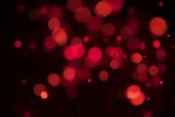 Bokeh purpurina roja abstracta. concepto de Navidad y año nuevo — Foto de Stock
