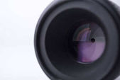 Closeup závěrky fotoaparátu izolovaných na bílém pozadí.