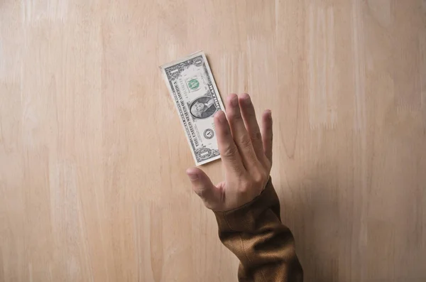 Businessman refusing money from a bribe on wooden table — Stock Photo, Image