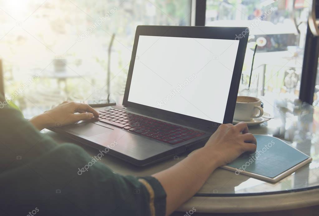 freelance business woman working at table in cafe 