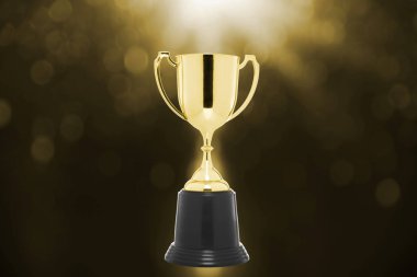 ışık altın bokeh arka plan üzerinde kazanan cup. 