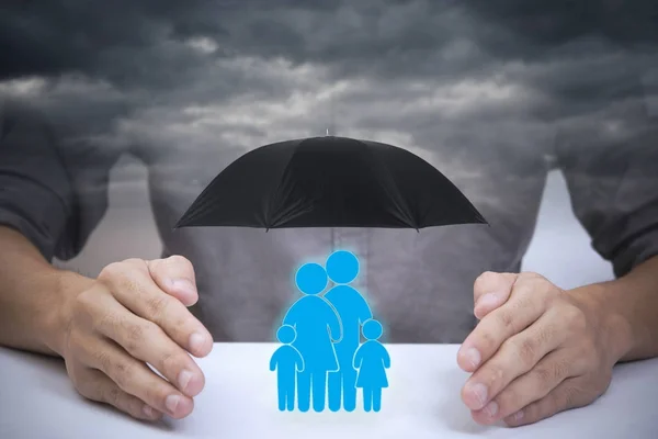 Business salesman agent hand holding family icon — Stock Photo, Image