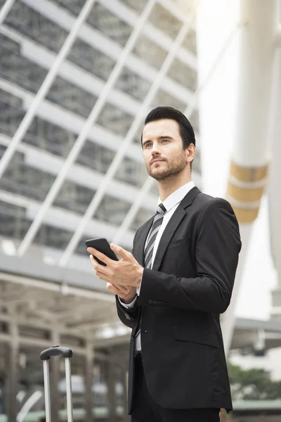 Handsome businessman using mobile phone. concept communication.