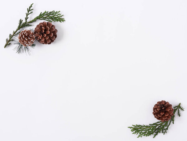 Christmas composition background with decorations pine cone on white background. winter, new year concept. Flat lay, top view, copy space.