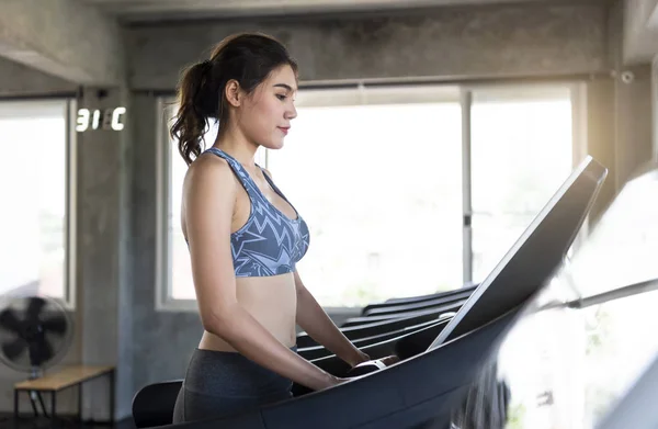 Asian women exercise runner at gym fitness. healthy lifestyle and workout concept. — Stock Photo, Image