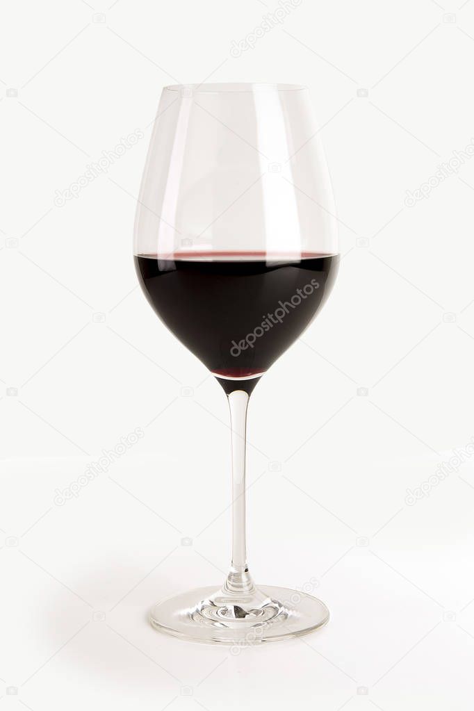 Big glass of red wine isolated on white background