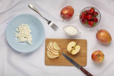 Healthy breakfast or snack. Fruits, cottage cheese. strawberries apples