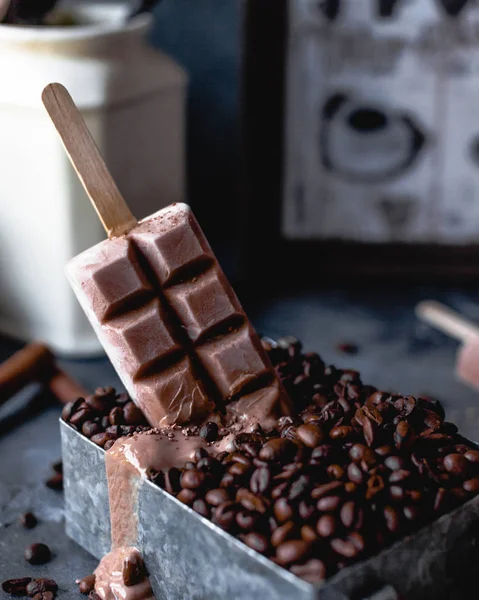 Chocolate with coffee bars on wooden sticks — Stock Photo, Image