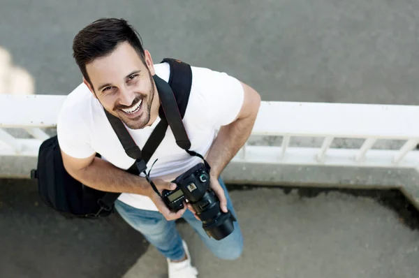 Photographer standing with DSLR camera. — Stock Photo, Image