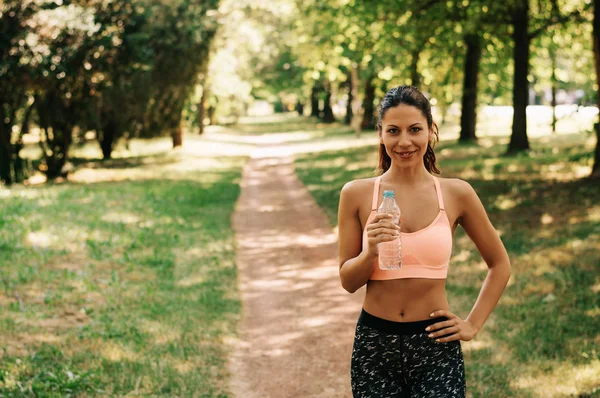 stock image woman with water bottle