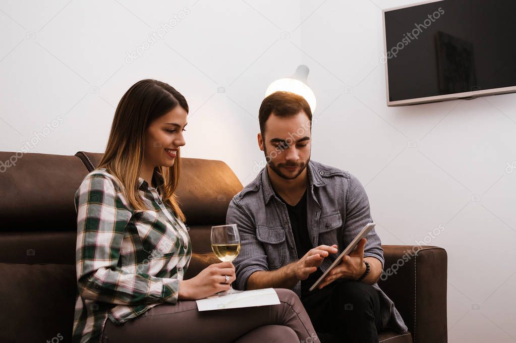 Young couple watching tablet 