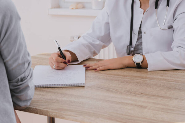 Doctor writing prescription 