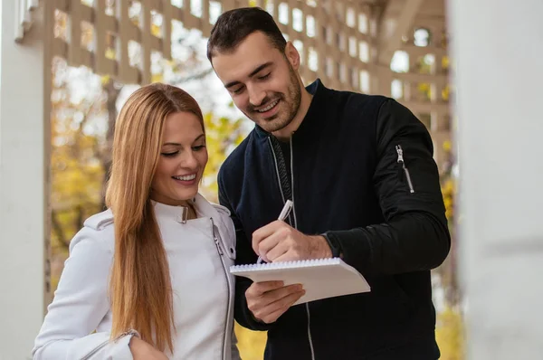 Business colleagues taking notes — Stock Photo, Image