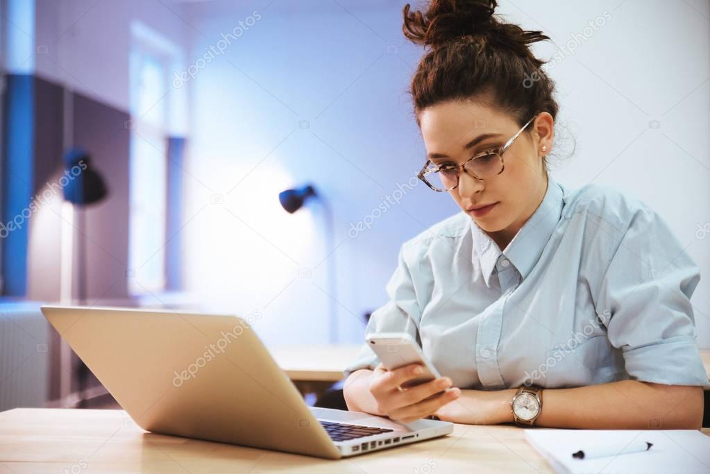 Female student using laptop 