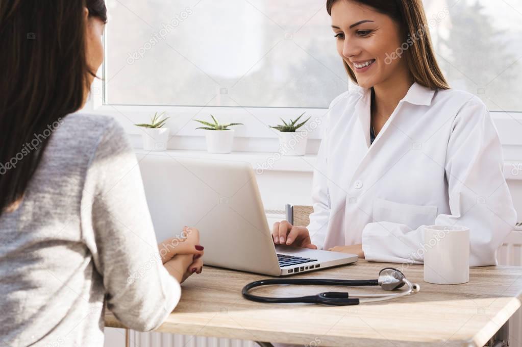 female doctor using laptop