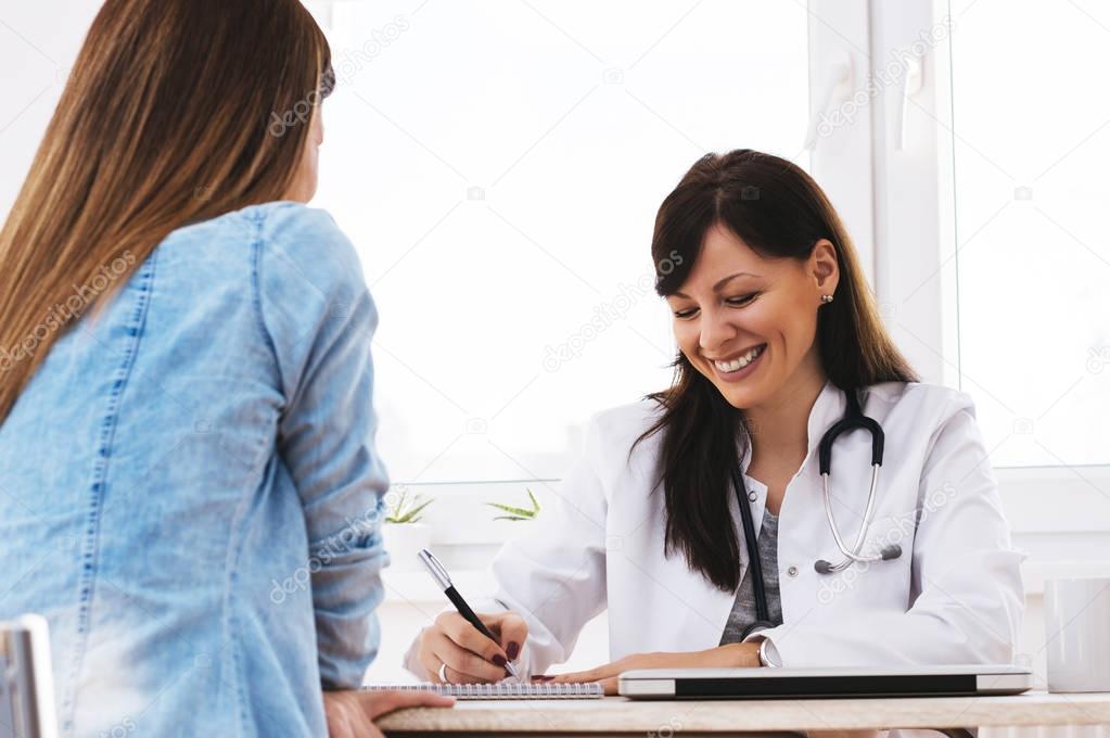 Girl having consultation with doctor