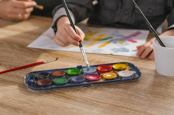 Happy family painting at home