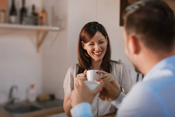 Couple relaxing at home with coffee — Stock Photo, Image