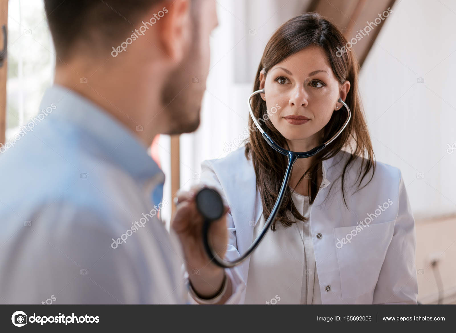 Doctor Listening Heartbeat Of Patient Stock Photo Image By C Bnenin