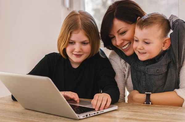 Family having fun with laptop