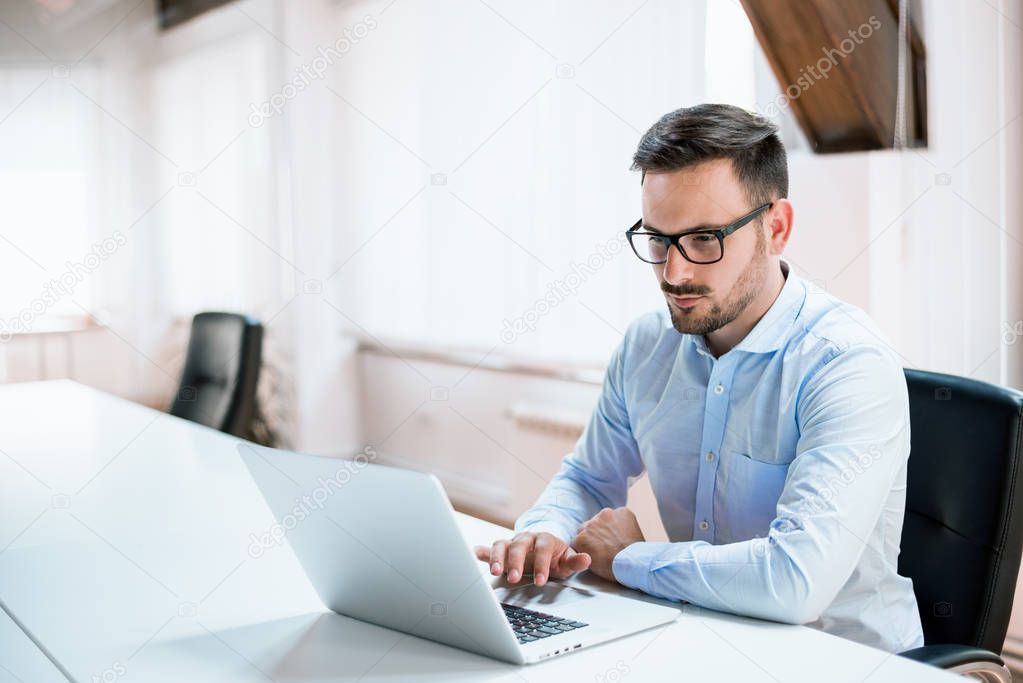 Businessman working with laptop 