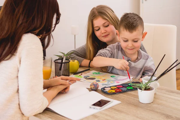 Happy family painting at home