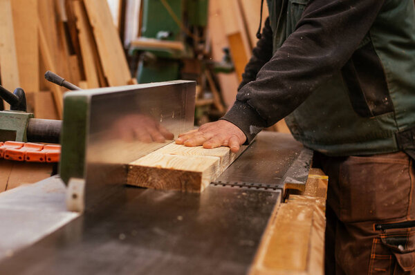 Carpenter working with wood 