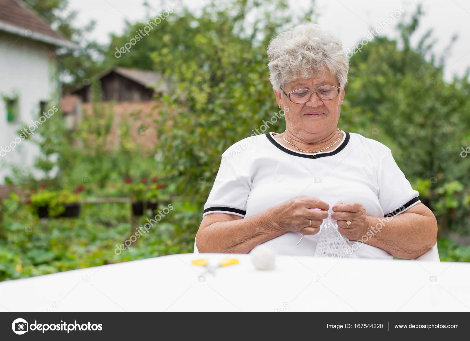 Beautiful grandma knitting Stock Photo by ©bnenin 167544220
