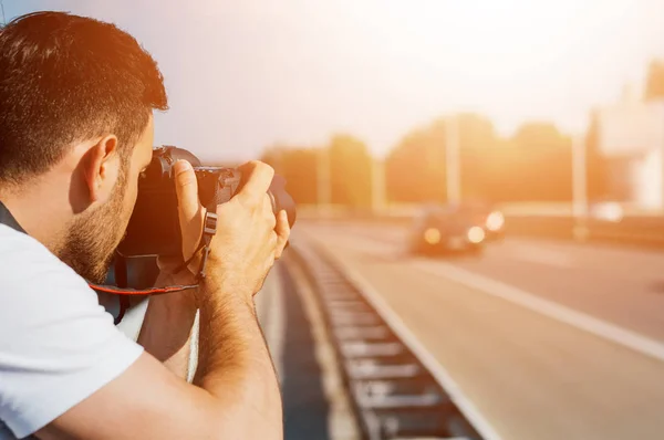 Photographer photographing urban road. — Stock Photo, Image