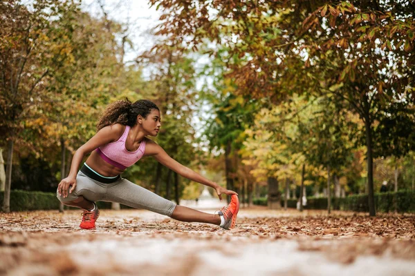 Woman preparing for autumn training — Stock Photo, Image