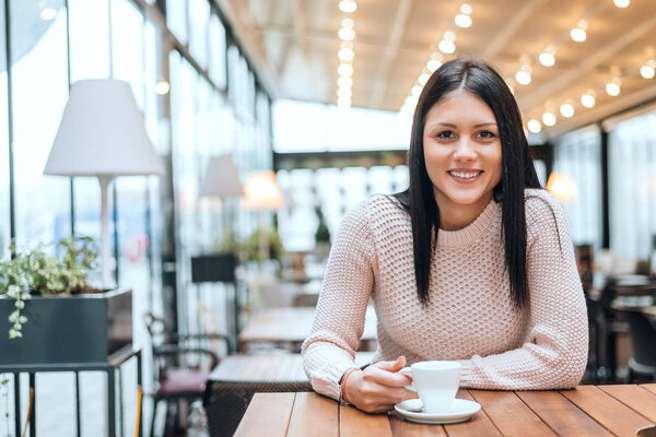 woman in modern cafe restaurant.