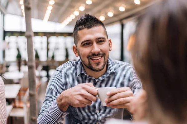 Portrait of young man sitting at a cafe — Stock Photo, Image