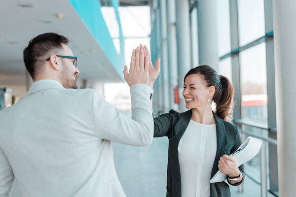  Two business people high-five