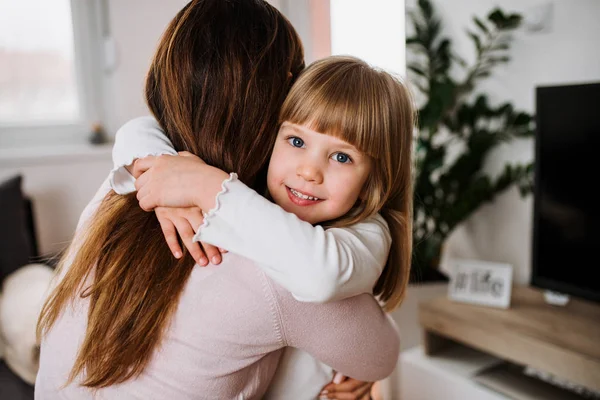 Smiling Girl Hugging Her Mother Home — Stock Photo, Image