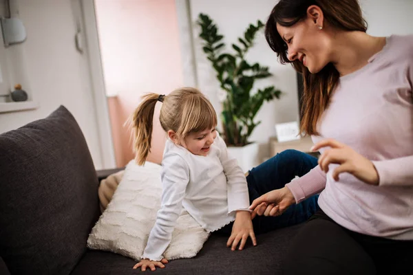 Mother Tickling Little Daughter Home — Stock Photo, Image